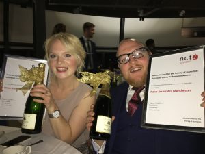 Rachel Bull and Andrew Greaves smiling holding their awards for top NCTJ-accredited courses.