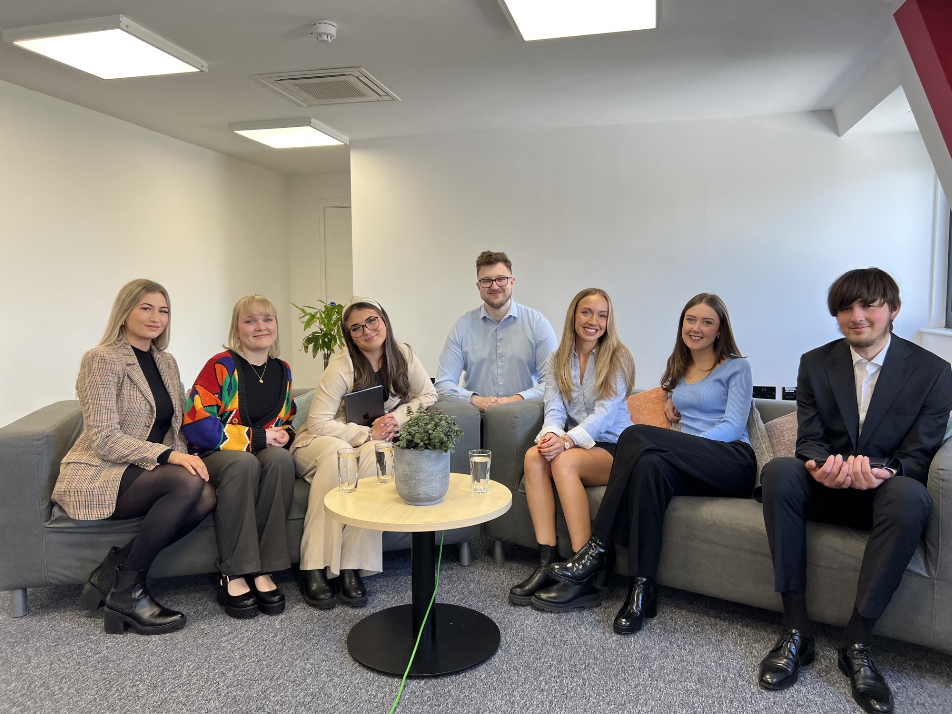 A photo of our undergraduate journalism trainees. They are smiling and posing for a photo. 