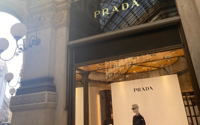 The Prada store with mannequins in the window.