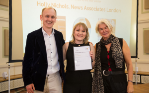 Holly Nichols collecting her podcast of the year award from Alex Crawford at the NCTJ Awards for Excellence.
