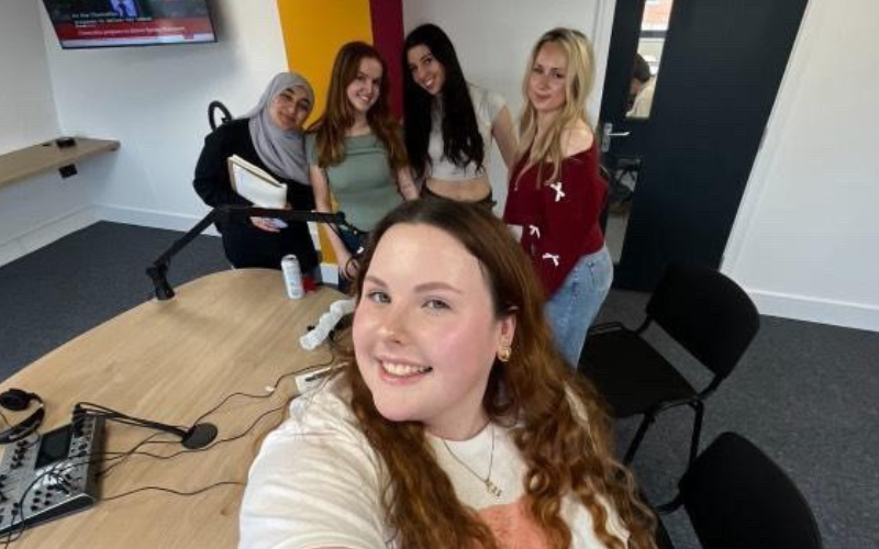 Podcast hosts in the studio recording their trending podcast