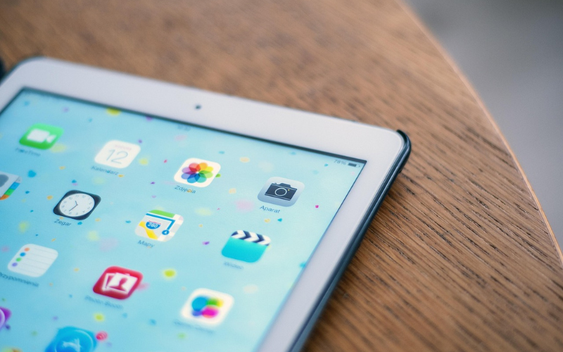 Photo of iPad on a wooden table.