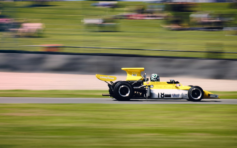 A photo of a racecar on the track.