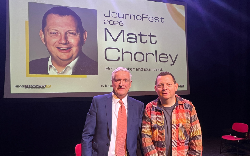 A photo of journalism training consultant Graham Dudman and Broadcaster and journalist Matt Chorley on stage at JournoFest. 2026